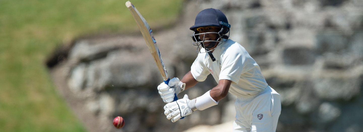 Pupil playing cricket