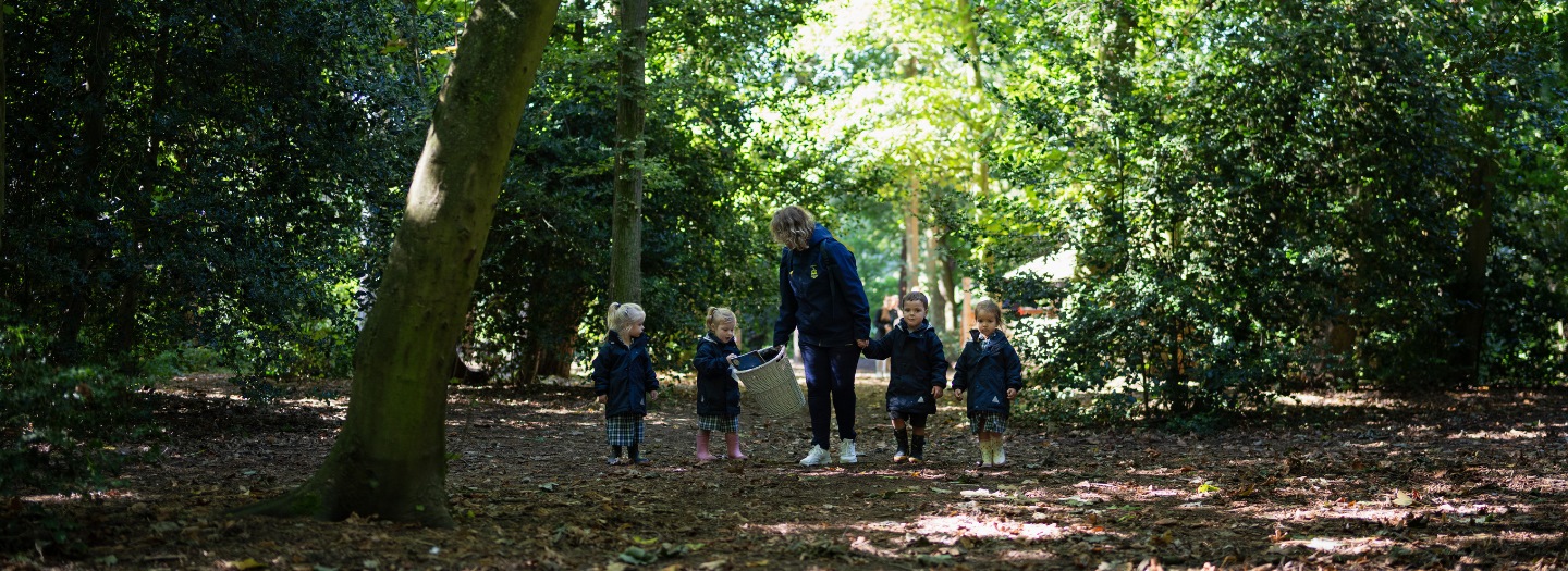 Pre-Prep pupils walking through the forest.