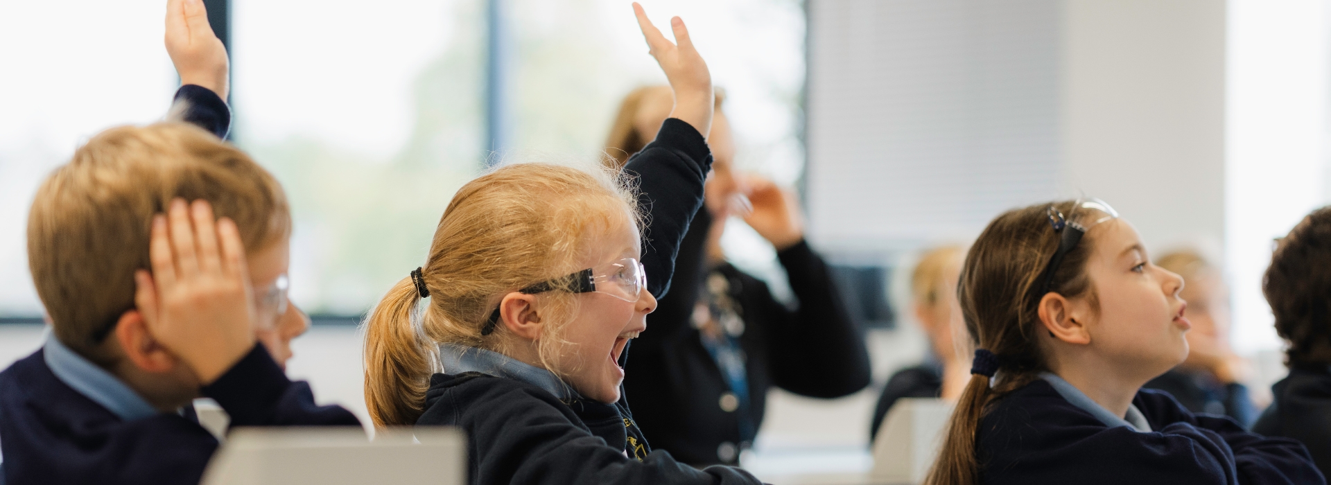 Young girl sitting in a science lesson.