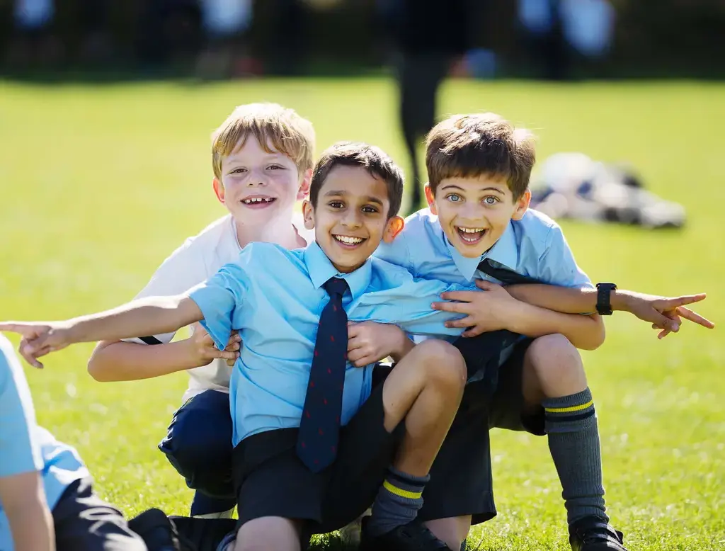 Pupils having fun in the school grounds at Repton Prep
